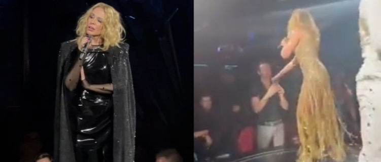 Kylie Minogue tira fã do celular pra que ele curta o show, em Las Vegas